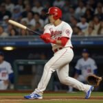 Los Angeles Dodgers’ Shohei Ohtani swings powerfully, launching a home run during a June 2025 game against the New York Yankees.