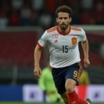 Spanish midfielder Gavi sprints across the pitch during a Euro 2025 qualifier match against Serbia, showcasing his dynamic return.