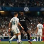 Real Madrid players celebrating after scoring late goal against Manchester City in Champions League quarterfinal