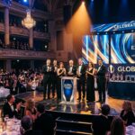 Award winners celebrate on stage at elegant gala event