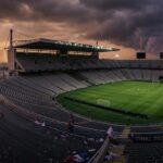 Modern stadium with racing circuit and football field simultaneously